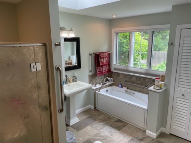 Bathroom with shower and whirlpool tub
